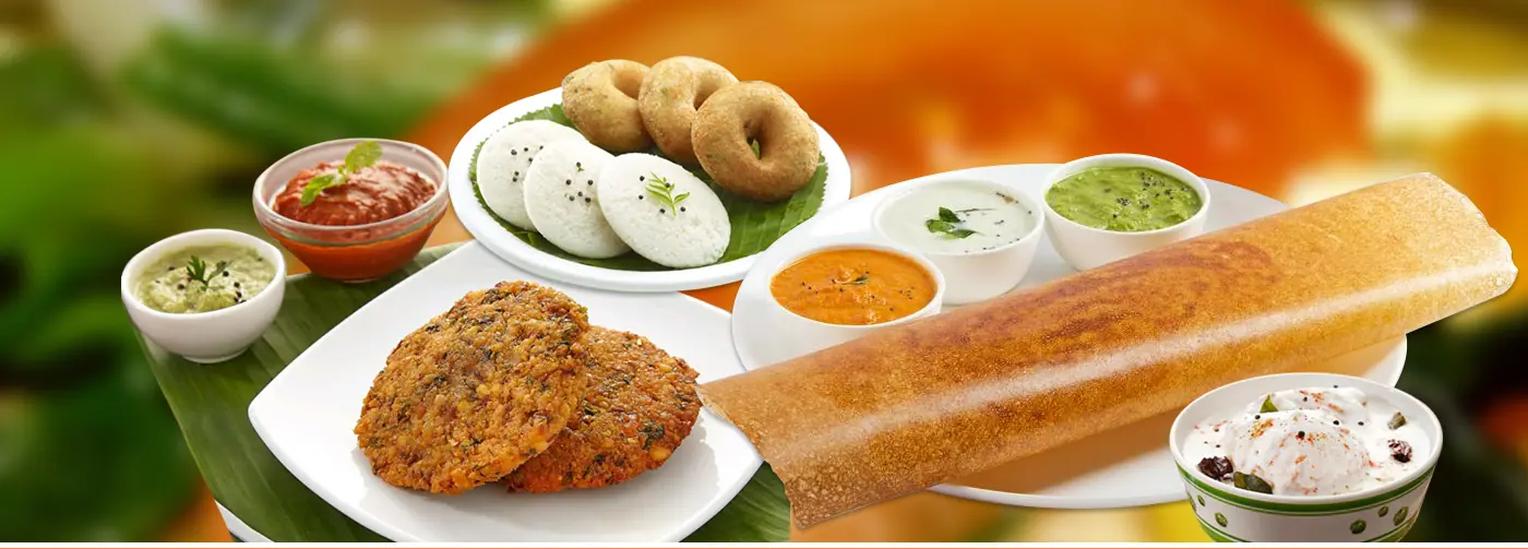 Idly, medu vada and dosa with sambar and chutneys